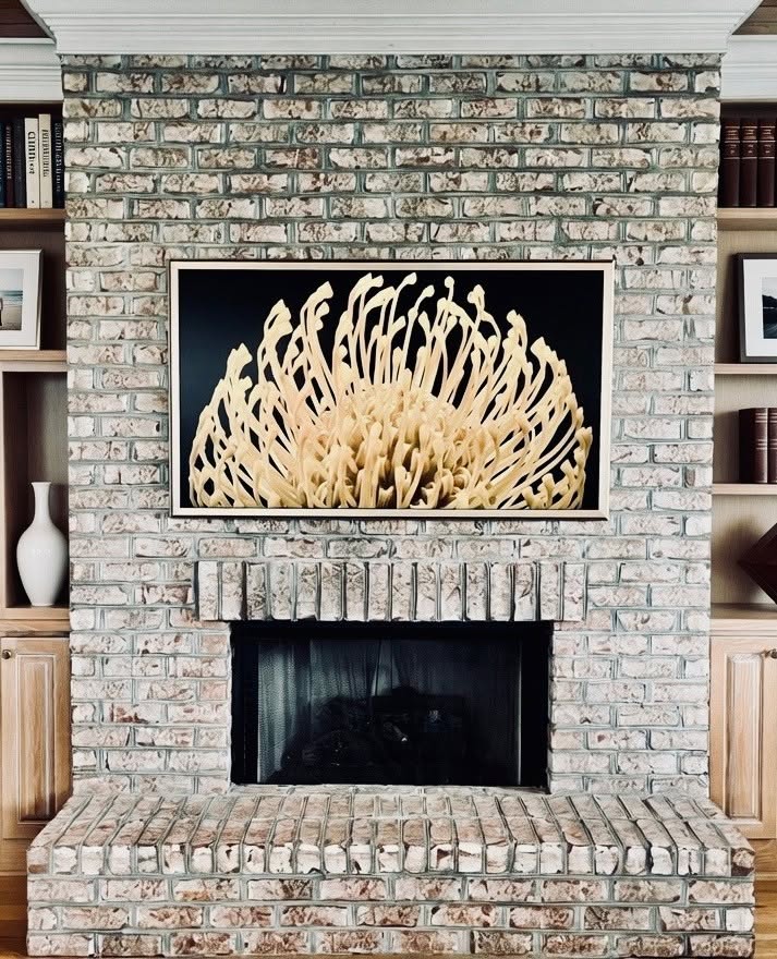 Frame TV installation above home fireplace